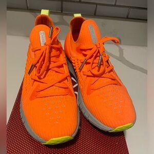 Bright orange under armor women sneakers